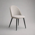 Chaise de salle à manger rembourrée en polyester et acier, dossier arrondi, beige clair et noir, 50 × 56 × 84 cm