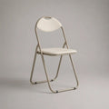 Chaise pliante en acier tubulaire et plastique blanc, dossier arrondi avec poignée, 78 × 45 × 47 cm